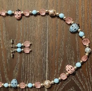 24" light blue/pink ladybug necklace with earrings